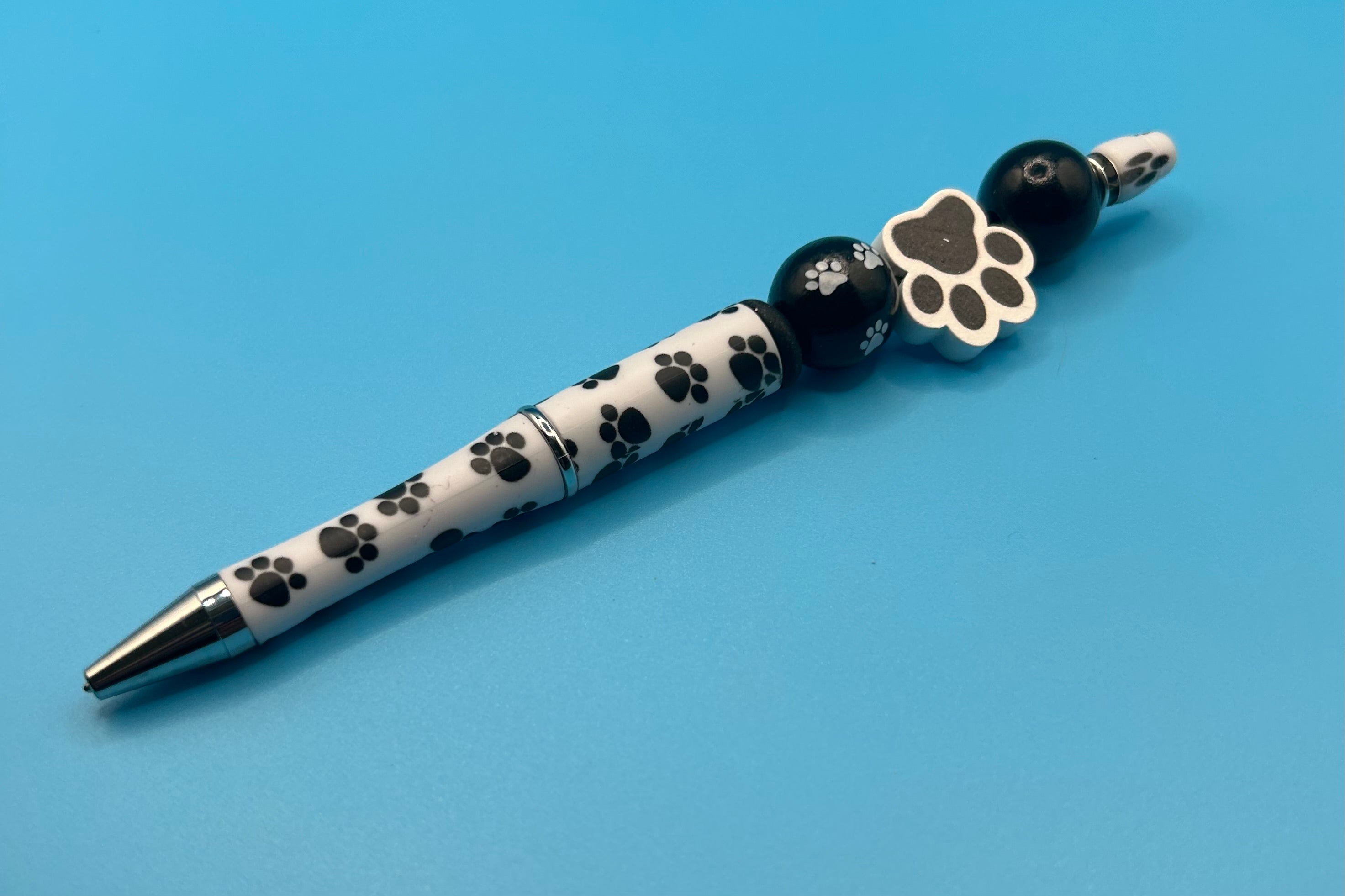 Black Pawprint Pebs (set of 2)